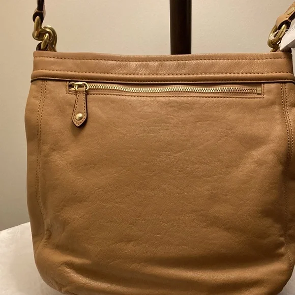 This is a coach leather bag with a shoulder strap and a carry handle - Picture 3 of 6